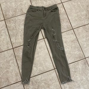 Distressed olive skinny jeans